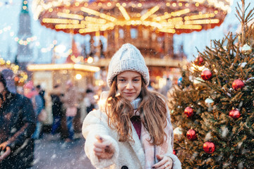 Wall Mural - Girl walking on Christmas Market on Red Square in Moscow