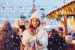 © Alena Ozerova - Girl walking on Christmas Market on Red Square in Moscow