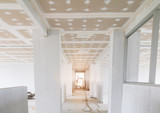 Fototapeta  - gypsum board ceiling structure and plaster mortar wall painted foundation white decorate interior room in building construction site