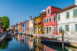 Colorful houses are reflected in the channel