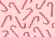 Candy cane for party design on pink background.