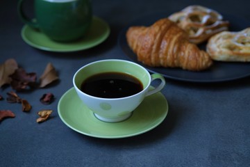 Wall Mural - cup of coffee and fresh croissants