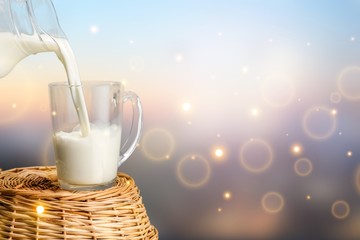 Canvas Print - Glass of milk and bottle on  background