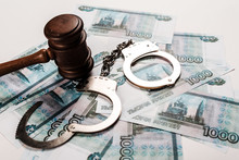 Wooden Gavel Near Handcuffs On Russian Money