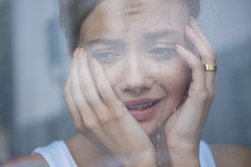 Wall Mural - selective focus of upset young woman crying at home