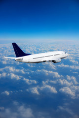 Wall Mural - sky and clouds from above the ground viewed from an airplane