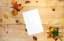 Autumn Mockup For Greeting Cards On A Wooden Background With Autumn Leaves And Berries, Top View, Flat Lay Composition
