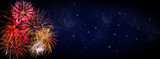 Fototapeta Na sufit - Fireworks on blue background with stars and space for text