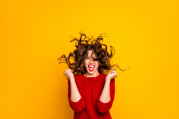 Canvas Print - Photo of cheerful ecstatic funny hilarious victorious girlfriend rejoicing with wind blowing at her face isolated over yellow vivid color background