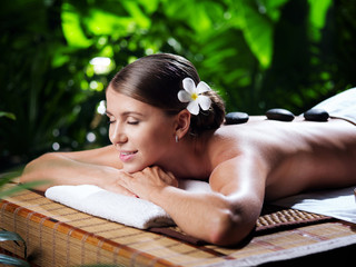 portrait of young beautiful woman in spa environment.  