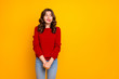 © deagreez - Photo of pretty curly wavy charming cute cheerful nice good girlfriend standing hesitating and shy looking away at something with hands folded isolated over yellow vivid color background