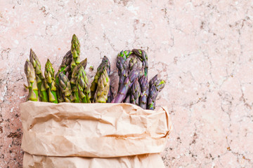 Canvas Print - Top view of bunch of fresh purple and green asparagus spears