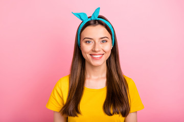 Sticker - Portrait of charming youngster looking with toothy smile wearing yellow t-shirt isolated over pink background