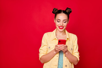 Wall Mural - Pretty lady holding telephone hands wear casual outfit isolated red background