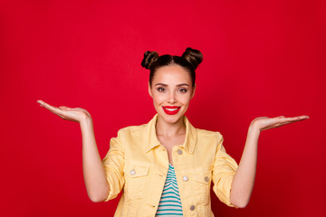 Photo of pretty lady holding new products on open arms wear casual stylish outfit isolated red background