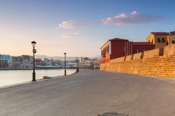 Wall Mural - Lighthouse of the old Venetian port in Chania at sunrise, Crete. Greece