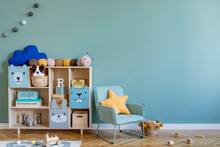 Scandinavian Nursery Room With Wooden Cabinet, Mint Armchair, Natural Teddy Bears And Plush Animal Toys. Cute Modern Interior Of Playroom With Eucalyptus Walls, Baby Accessories And Toys. Copy Space.