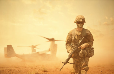 Military helicopters and forces between storm & dust in battlefield