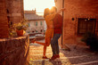 © luckybusiness - romantic couple kissing outdoor at the sunset.