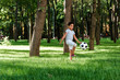 © LIGHTFIELD STUDIOS - cute african american child playing football on grass