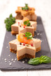 festive canape with foie gras and salmon on gingerbread toast