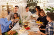 © Syda Productions - celebration, holidays and people concept - happy family having dinner party at home