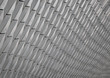 Gray abstract background with perspective. The scaly flaky of the pattern.
