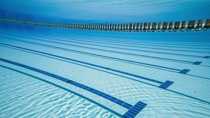 Wall Mural - Olympic Swimming pool under water background.