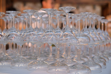 The empty wine glasses are organized at a wedding party