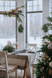 © Irina Polonina/Stocksy - Festively Decorated Room And Christmas Table For A Dinner