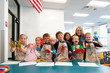 © Hill Street Studios/Stocksy - Elementary School Students Making Paint Handprints