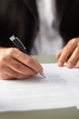 © 365mm/Stocksy - Closeup of man signing paper