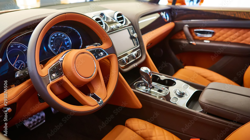Brown leather interior of a luxury car - obrazy, fototapety, plakaty 