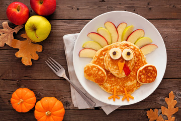 Sticker - Thanksgiving turkey pancake breakfast. Top view table scene against a rustic wood background.