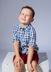 Wall Mural - portrait of a little fashionable boy in the studio