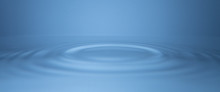 Ripples Moving Outward, Concentric Circles On Calm, Still Water.