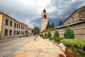 Bansko, Bulgaria. Street in Old Town with view of a historical Holy Trinity church.