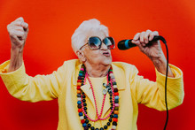 Funny Grandmother Portraits. Senior Old Woman Dressing Elegant For A Special Event. Rockstar Granny On Colored Backgrounds