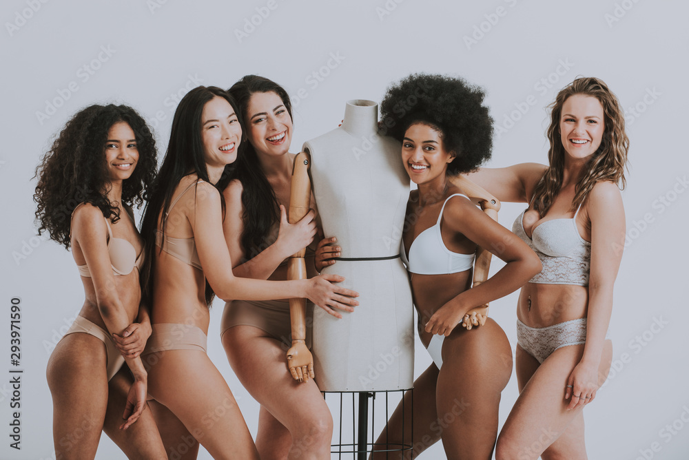 Group of women with different body and ethnicity posing together to show the woman power and strength. Curvy and skinny kind of female body concept - obrazy, fototapety, plakaty 