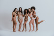 © oneinchpunch - Group of women with different body and ethnicity posing together to show the woman power and strength. Curvy and skinny kind of female body concept