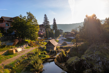 Small wooden houses by the river on popular picnic place Krupa na Vrbasu near the Banja Luka in Bosnia and Herzegovina