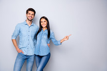 Photo Of Cheerful Trendy Charming Brown Haired Nice Cute Couple Of Two People Pointing At Emptiness Away Wearing Jeans Denim Jackets Isolated Over Grey Color White Background