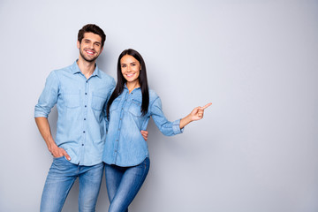 photo of cheerful trendy charming brown haired nice cute couple of two people pointing at emptiness 