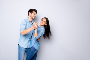 Canvas Print - Profile side view portrait of his he her she nice attractive charming lovely adorable cheerful cheery positive tender couple wearing casual dancing isolated on light white gray pastel color background