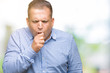© Krakenimages.com - Middle age arab business man over isolated background feeling unwell and coughing as symptom for cold or bronchitis. Healthcare concept.