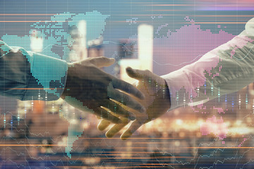 Double exposure of financial chart and world map on cityscape background with two businessmen handshake. Concept of international investment