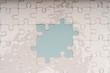 © MuhammadFadhli - Closed up shot of blank white puzzle pieces, selective focus, copy space for text