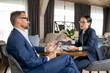 © pressmaster - Young confident Asian businesswoman explaining her opinion to colleague