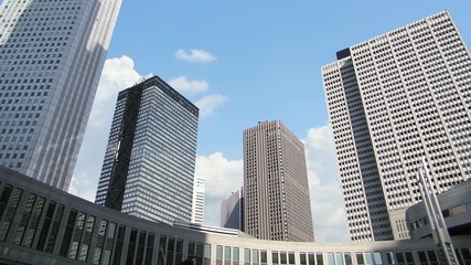 Canvas Print - clouds flying over skyscrapers