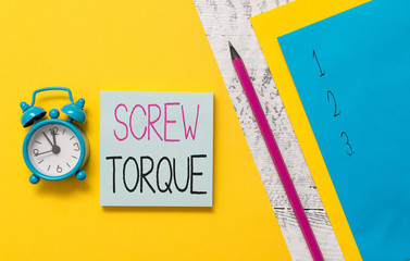 Poster - Conceptual hand writing showing Screw Torque. Concept meaning measure of the twisting force required to spin the nut Notepads marker colored paper sheets alarm clock wooden background